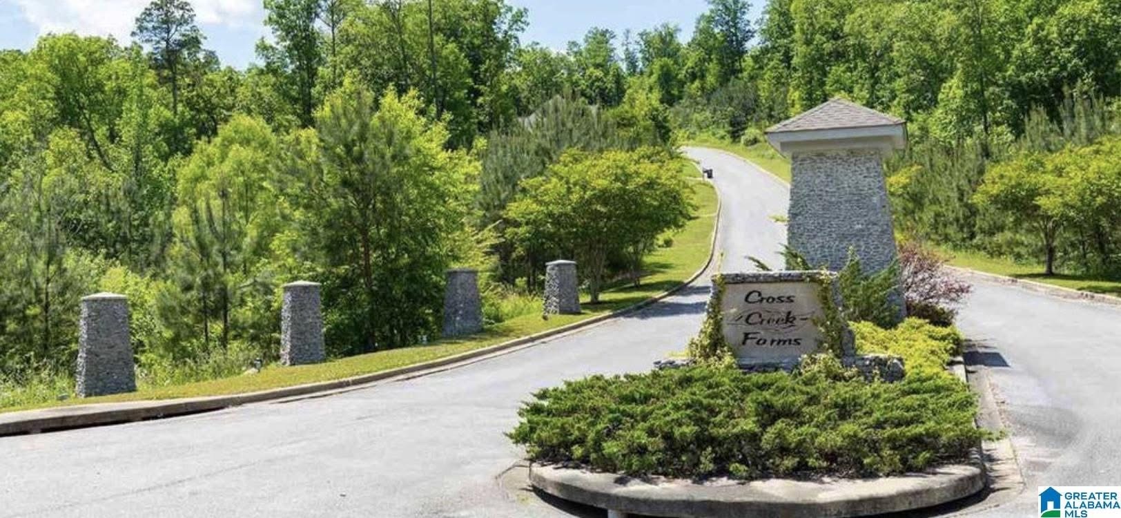 Cross Creek Farms entry monument with brick signage and landscaped plantings
