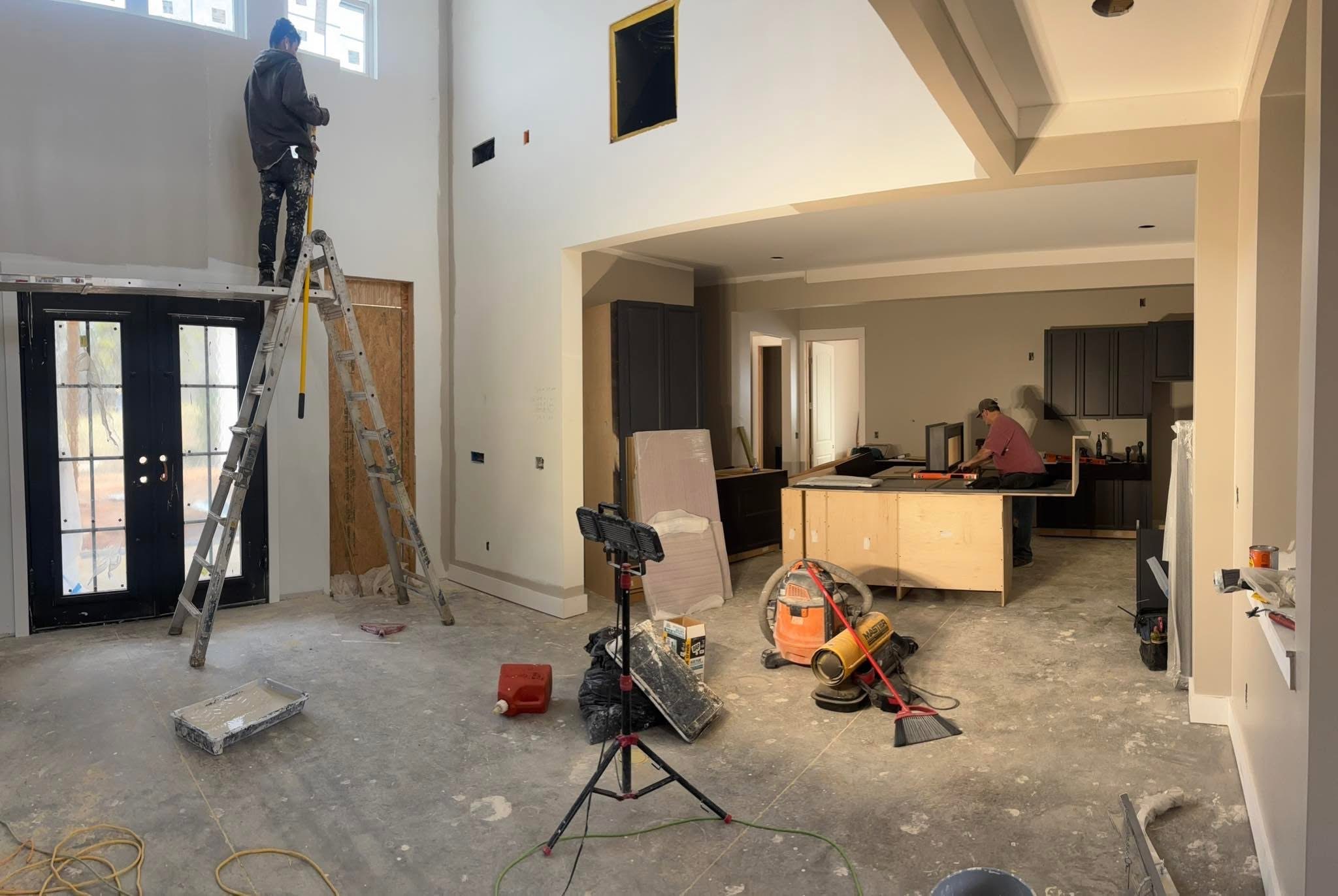 Drywall and interior structure nearing completion inside the modern farmhouse