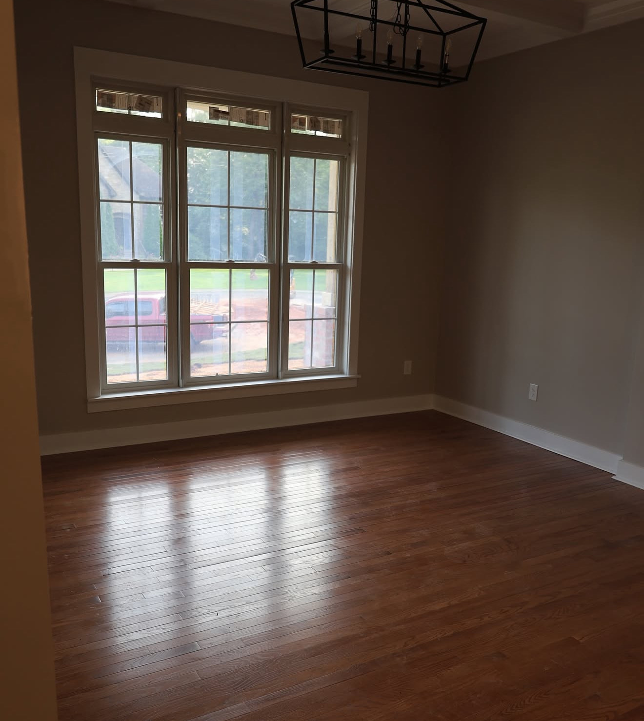 Close-up of newly installed hardwood flooring with natural grain detail inside the Trussville modern farmhouse