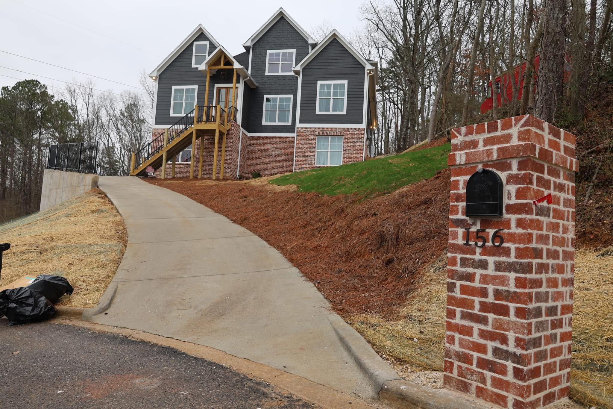 Completed Ridgeview Residence showing driveway and brick details