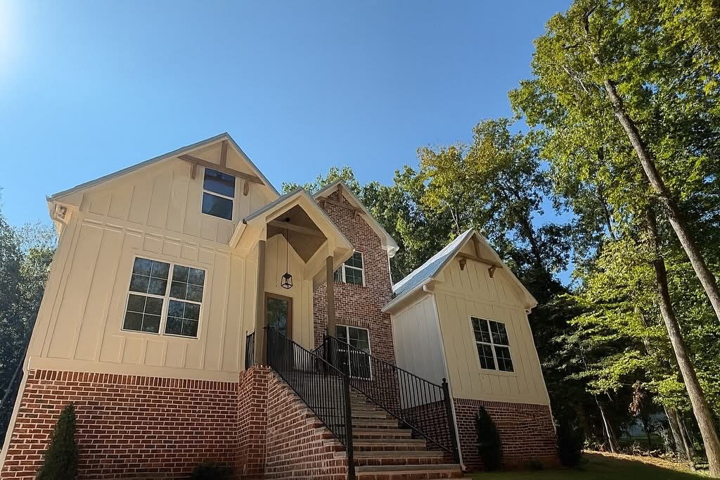 Low-angle view of front steps, gables, and metal roof accents